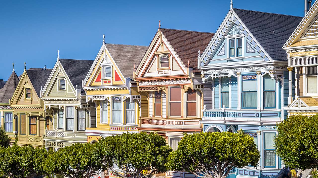 A row of multicolored Victorian houses