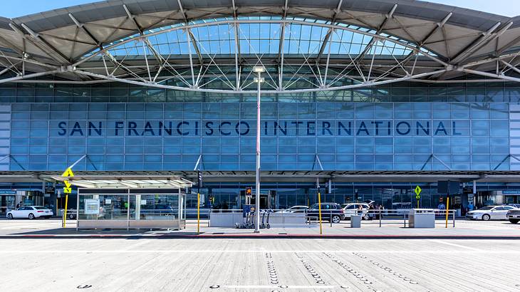 Entrance to an airport terminal with a "San Francisco International" sign