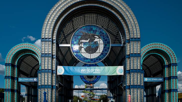 An arch-shaped entrance to a building featuring an image of a whale