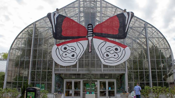 A building with a large red and white butterfly on it