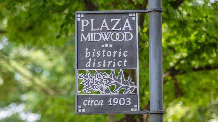 An iron sign that says "Plaza Midwood Historic District, Circa 1903"