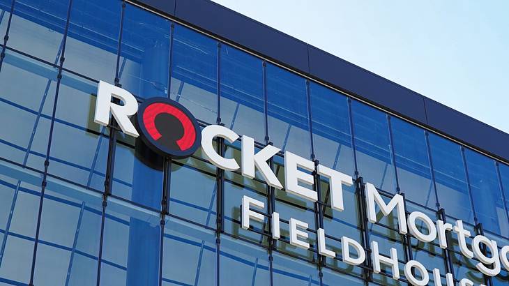 A glass building with a sign that says "Rocket Mortgage FieldHouse" A glass building with a sign that says "Rocket Mortgage FieldHouse"