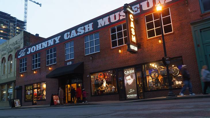 Brick building with large, white "Johnny Cash Museum" sign