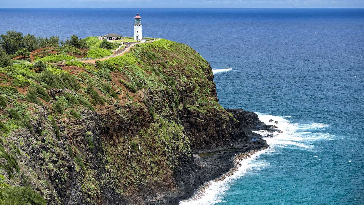 Kilauea Point Lighthouse on a grassy cliff, one of the famous Kauai landmarks