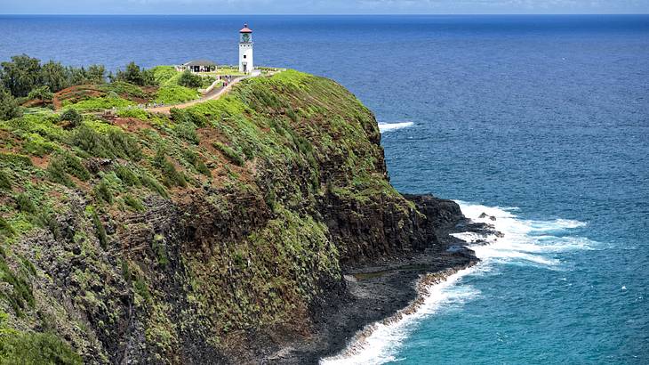 Kilauea Point Lighthouse on a grassy cliff, one of the famous Kauai landmarks