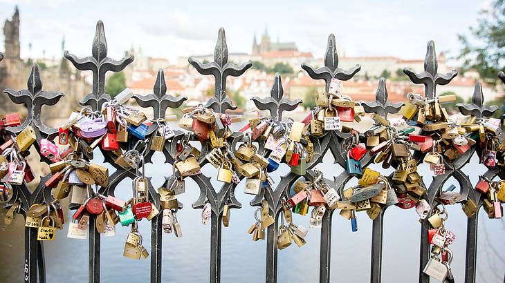 Close up shot of many padlocks on a bridge railing