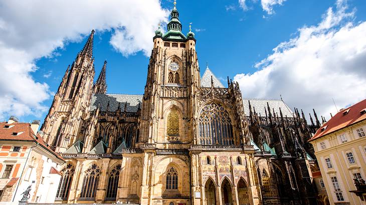 A cathedral from below against a partly cloudy sky