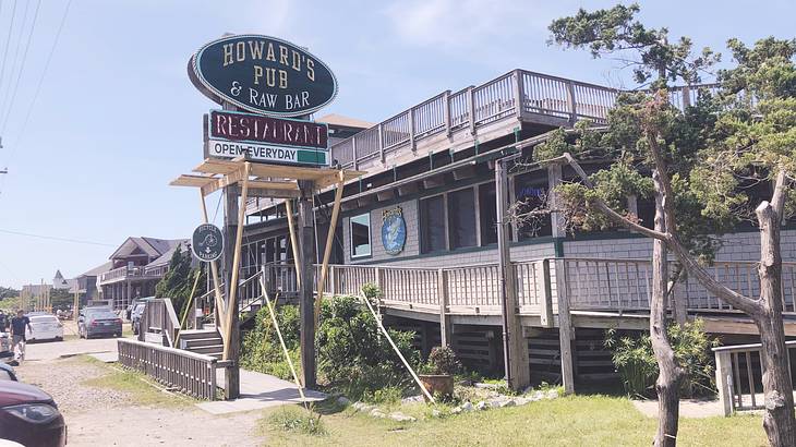 Howard's Pub sign and outside of the wooden building