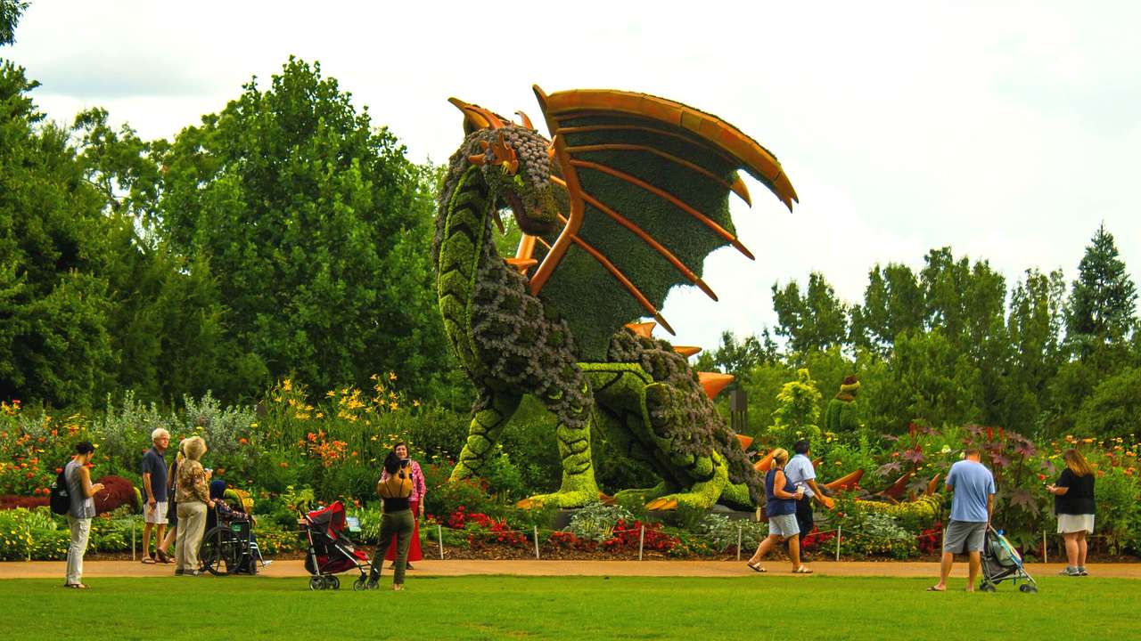 A dragon sculpture made of plants and flowers