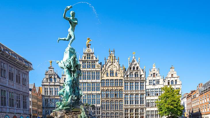 A Renaissance building next to an oxidized fountain with a statue of a man