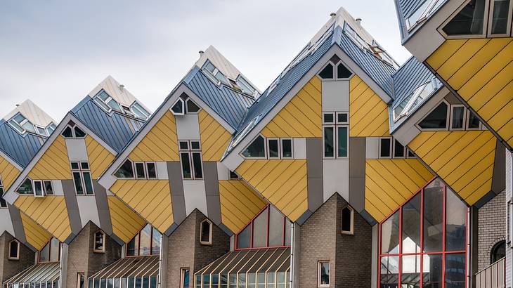 Futurist tilted cube-shaped houses lined up in a row