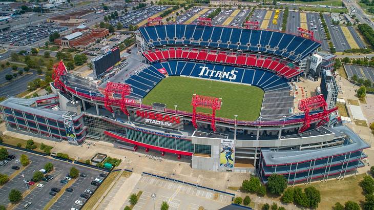 Aerial view of a football stadium with blue and red seats and a "Titans" sign