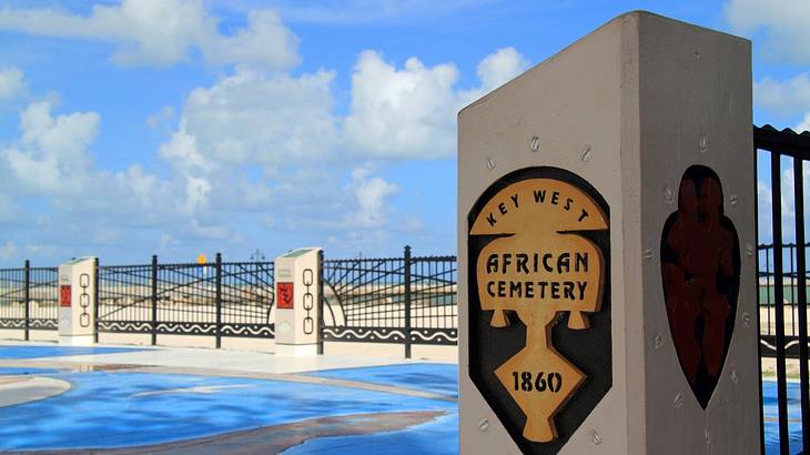 A post with a plaque that says "Key West African Cemetery 1860"