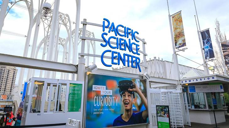 The entrance to a museum with a "Pacific Science Center" sign The entrance to a museum with a "Pacific Science Center" sign