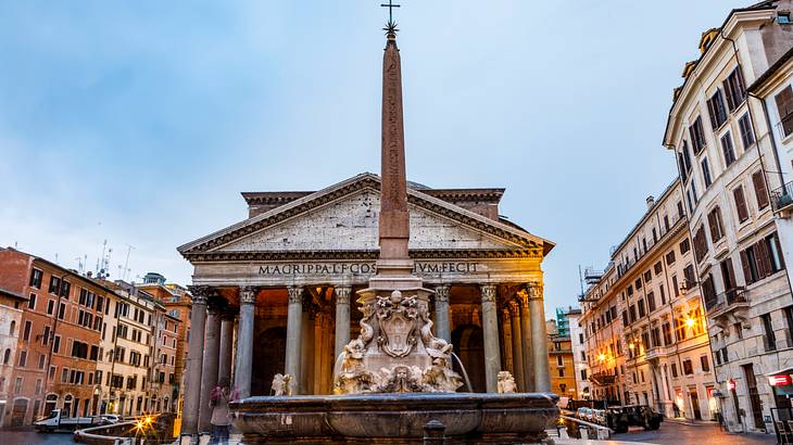 Majestic building of the Pantheon at dusk in the middle of a square Majestic building of the Pantheon at dusk in the middle of a square