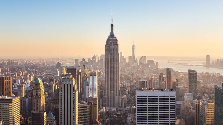 The Manhattan city skyline with the Empire State Building at sunset