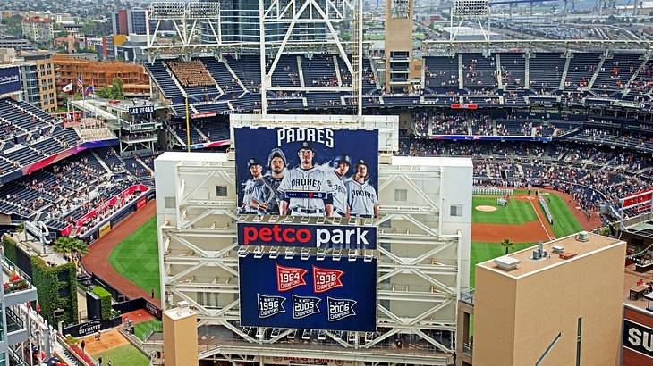 A baseball stadium with a sign that says "Padres, Petco Park" A baseball stadium with a sign that says "Padres, Petco Park"