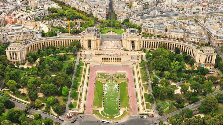 Top view of Trocadéro Gardens in the middle of green trees and buildings at the back