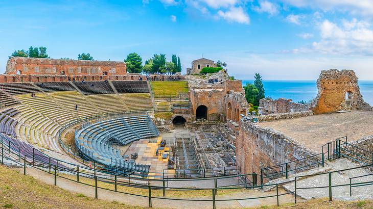 A panorama of an ancient Greek theatre overlooking the Mediterranean Sea