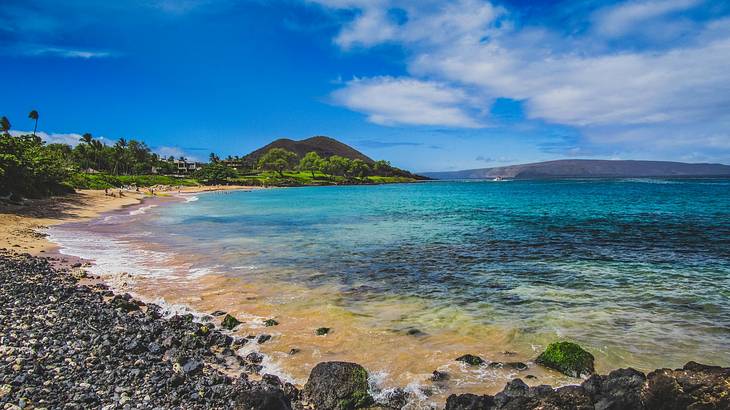 A rocky beach with blue water in Maui, Hawaii, USA
