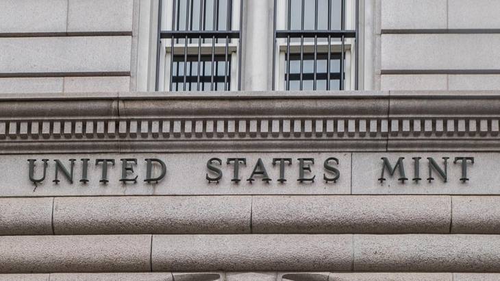 A stone building with the words "United States Mint" on it A stone building with the words "United States Mint" on it