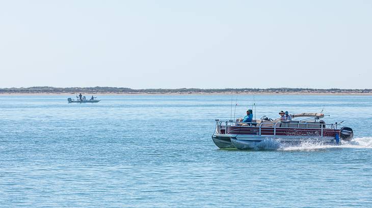 A boat on the water under a blue sky