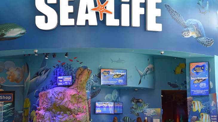 "Sea Life" signage over the admission counter with posters and ticket prices "Sea Life" signage over the admission counter with posters and ticket prices