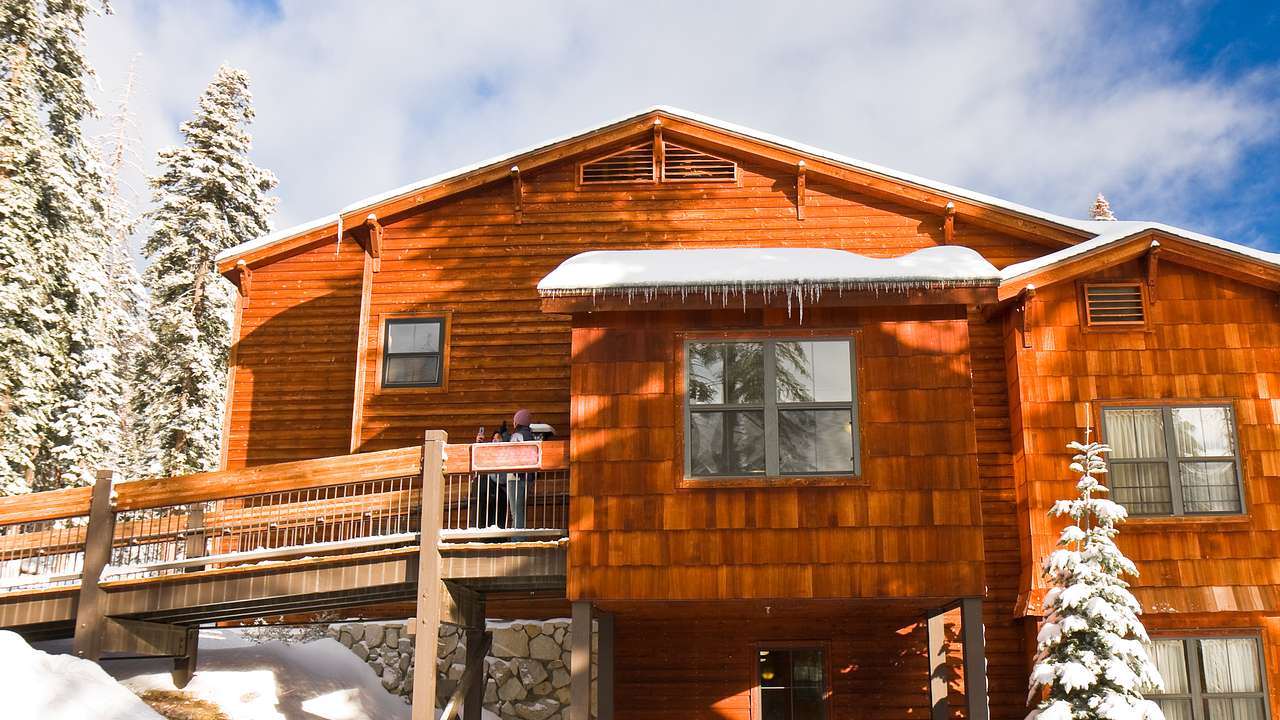 A cedar cabin in a snowy forest