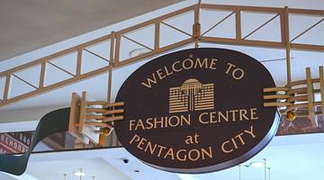 A sign that says "Welcome to Fashion Centre at Pentagon City"