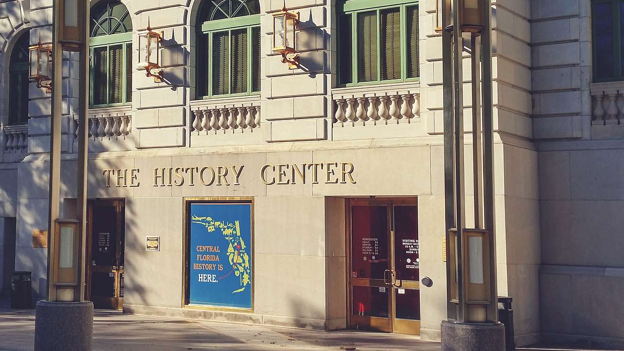 A building with pillars, windows and a sign saying "The History Center"