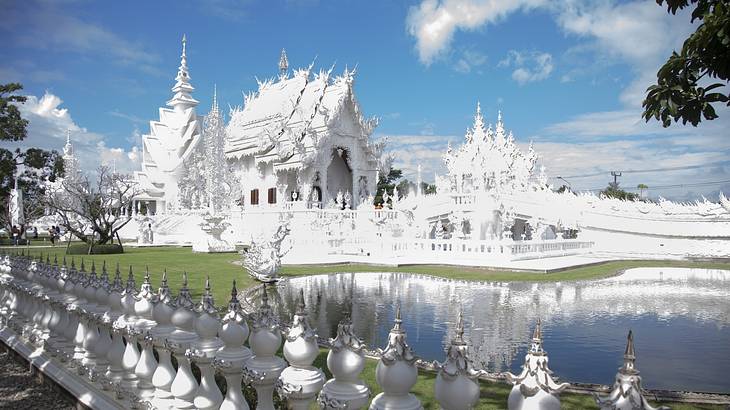 Magnificent side view of a detailed white temple, a famous Thailand landmark
