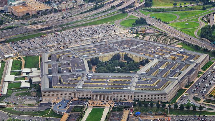 An aerial view of a large pentagon structure in the middle of a city