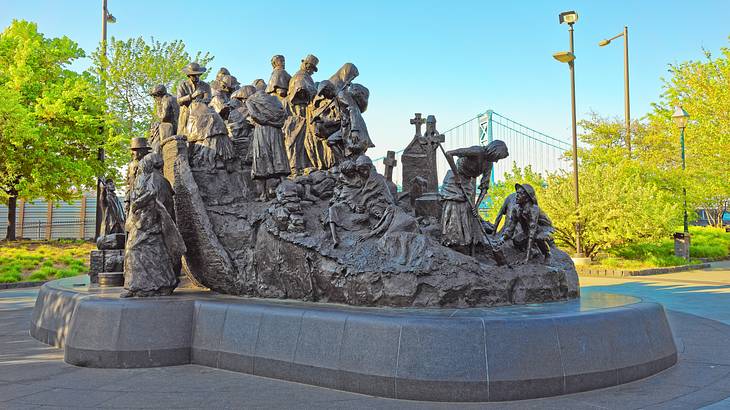 A bronze sculpture depicting people in a boat