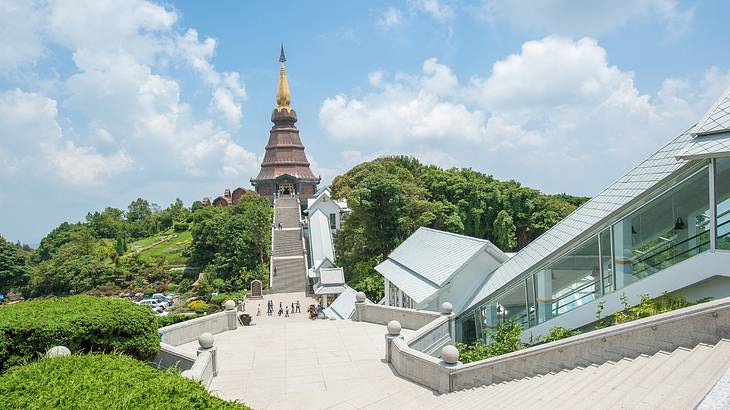 A view of a temple and the surrounding park from the top of stairs