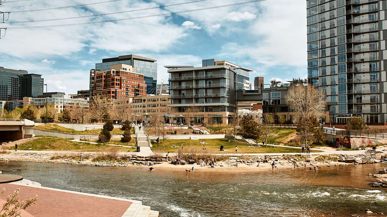 A river with paved banks near buildings