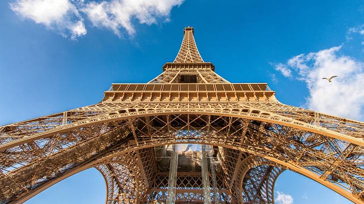 View of the Eiffel Tower against a blue sky, a must for your Paris bucket list