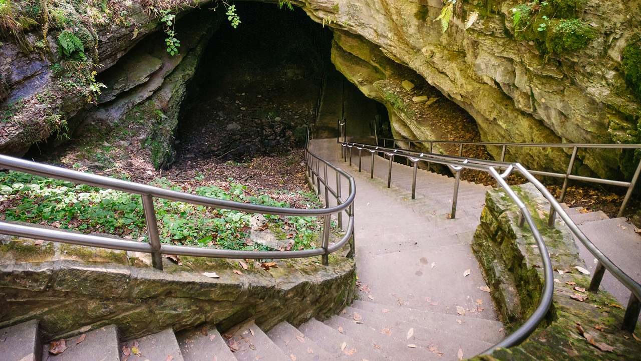 A curvy stairway leading down into a cave