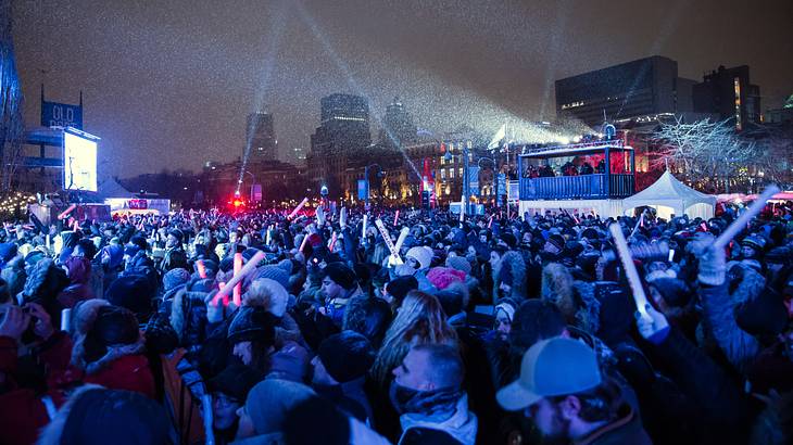 A large crowd of people in winter clothing celebrating the New Year