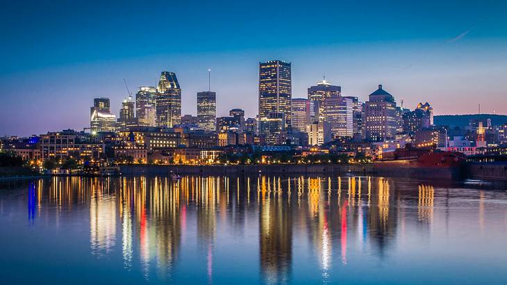 Canada nightlife - A city full of buildings across a river, Montreal, Quebec, Canada