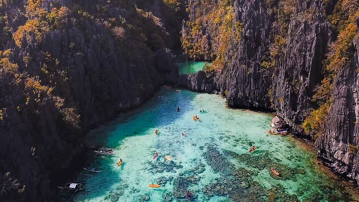 A clear, beautiful blue lagoon between tall rock face from above, Palawan