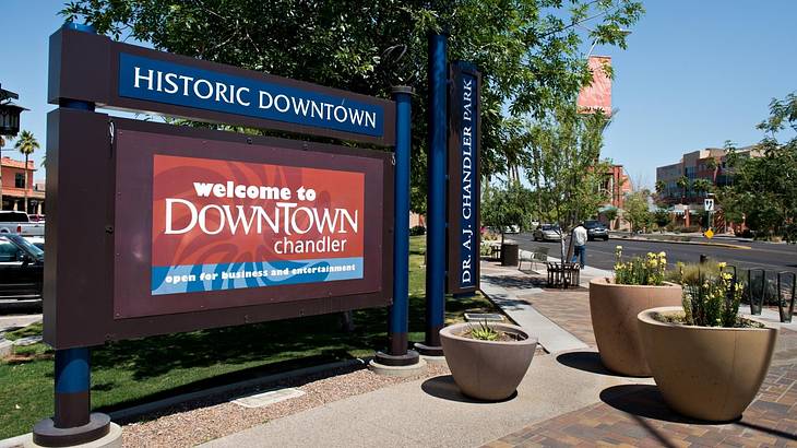 A sign in a downtown area that says "Welcome to Downtown Chandler"
