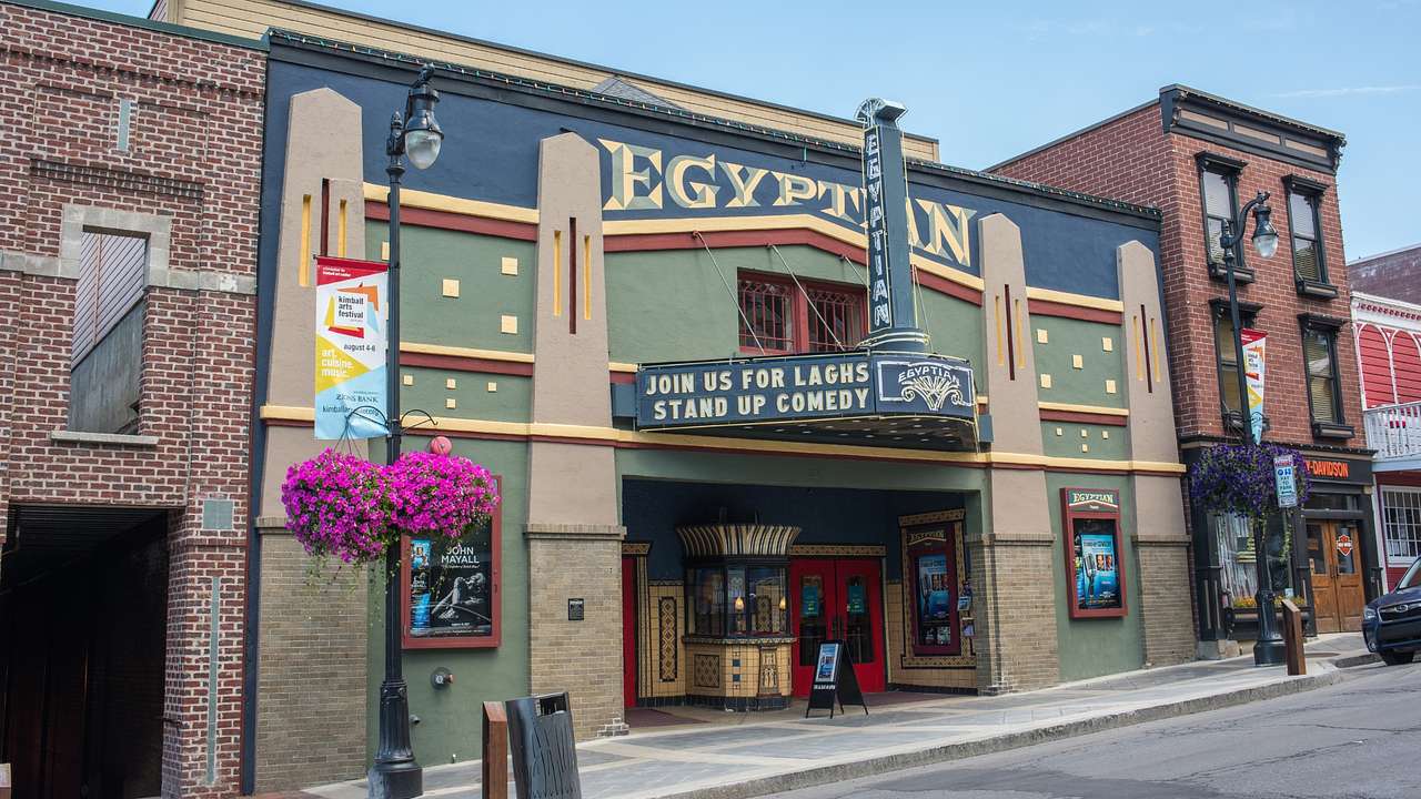 The exterior or a green and navy blue theater with a sign that says "Egyptian"