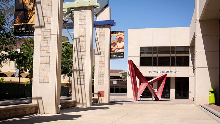 A museum with an "El Paso Museum of Art" sign and a red sculpture