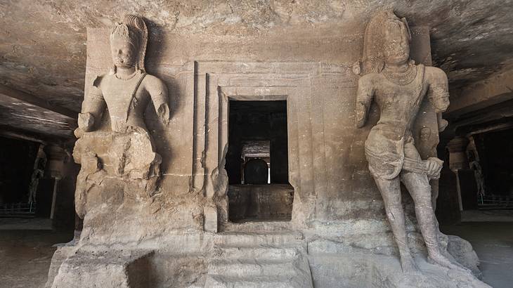 Two archaeological sculptures in an ancient cave