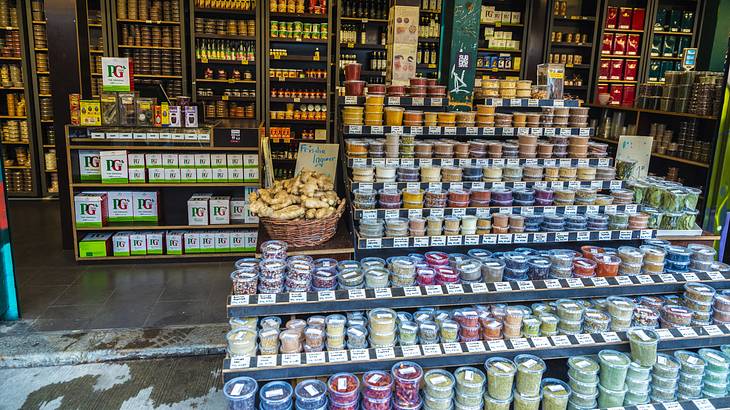 A shop selling various colorful spices and flavors in containers