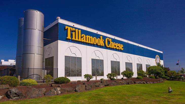 A building with a blue and yellow sign saying "Tillamook Cheese"