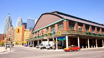 View of the St. Lawrence Market building, a street and vehicles, Toronto, Ontario