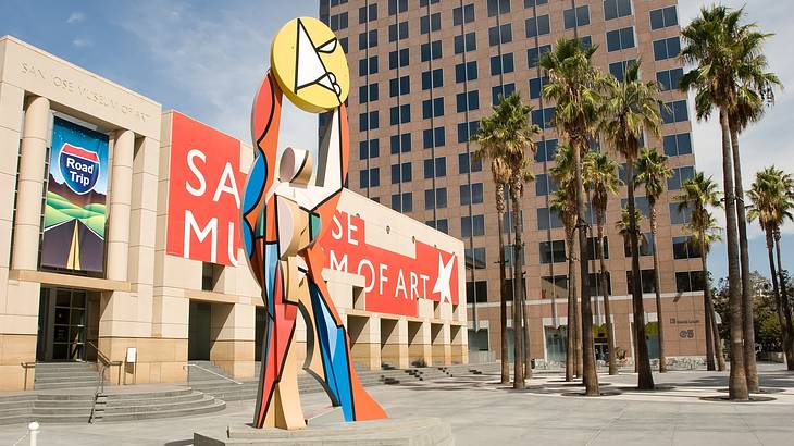 A colorful art installation in front of a building