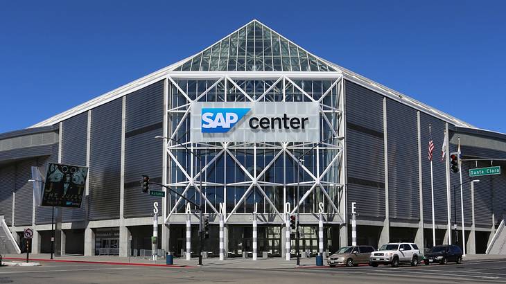 An arena with a glass front and a sign that says "SAP Center"