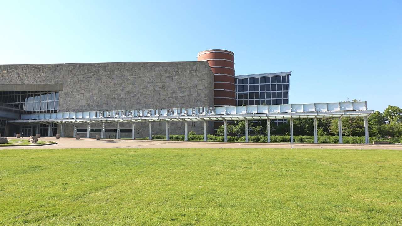 Green grass next to a modern building with an Indiana State Museum sign